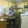 Alex Pavlenko with resonator for linear electron accelerator.