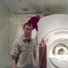 Egor Kaniukov helps to fill liquid helium MRI of GE Healthcare company