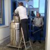 V. Kniga and S. Demyanov prepare Dewar for the overflow of liquid helium